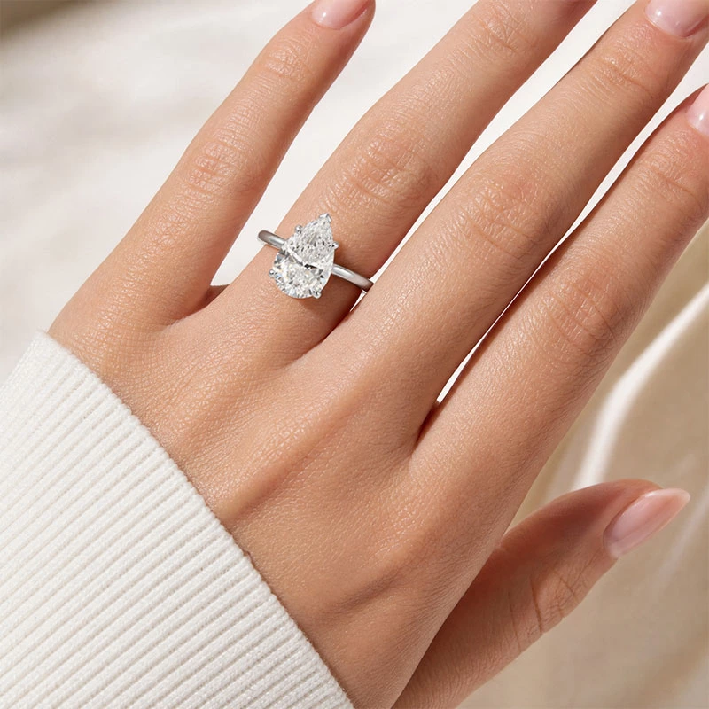 Pear Cut Solitaire Engagement Ring Wearing Effect